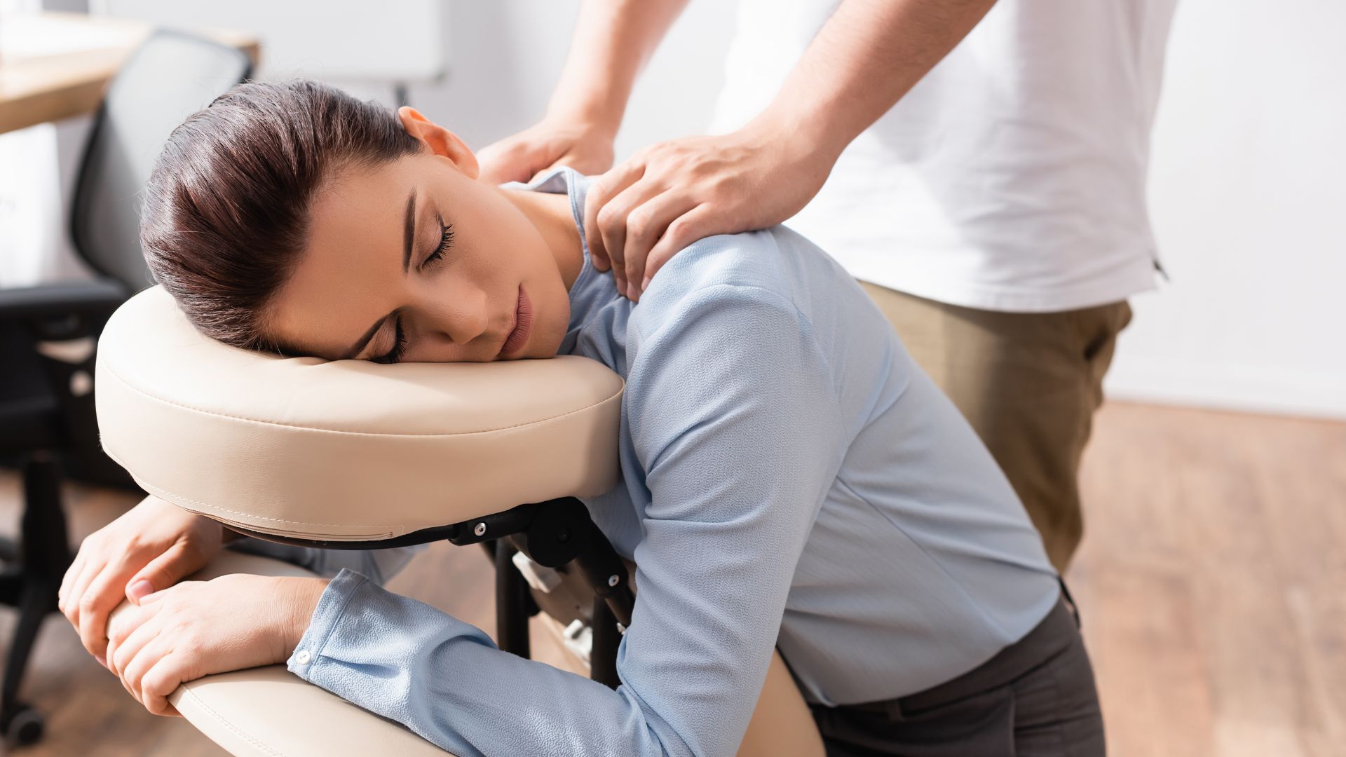 woman receiving chair massage at corporate event