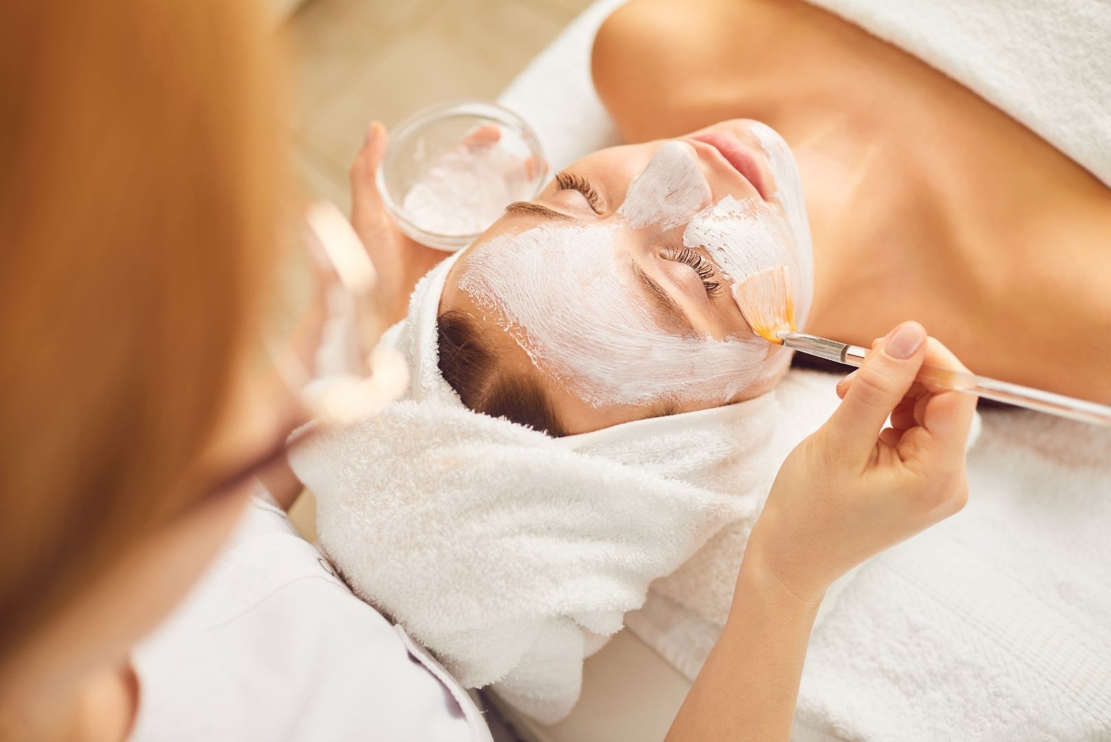 woman receiving express age-defying facial