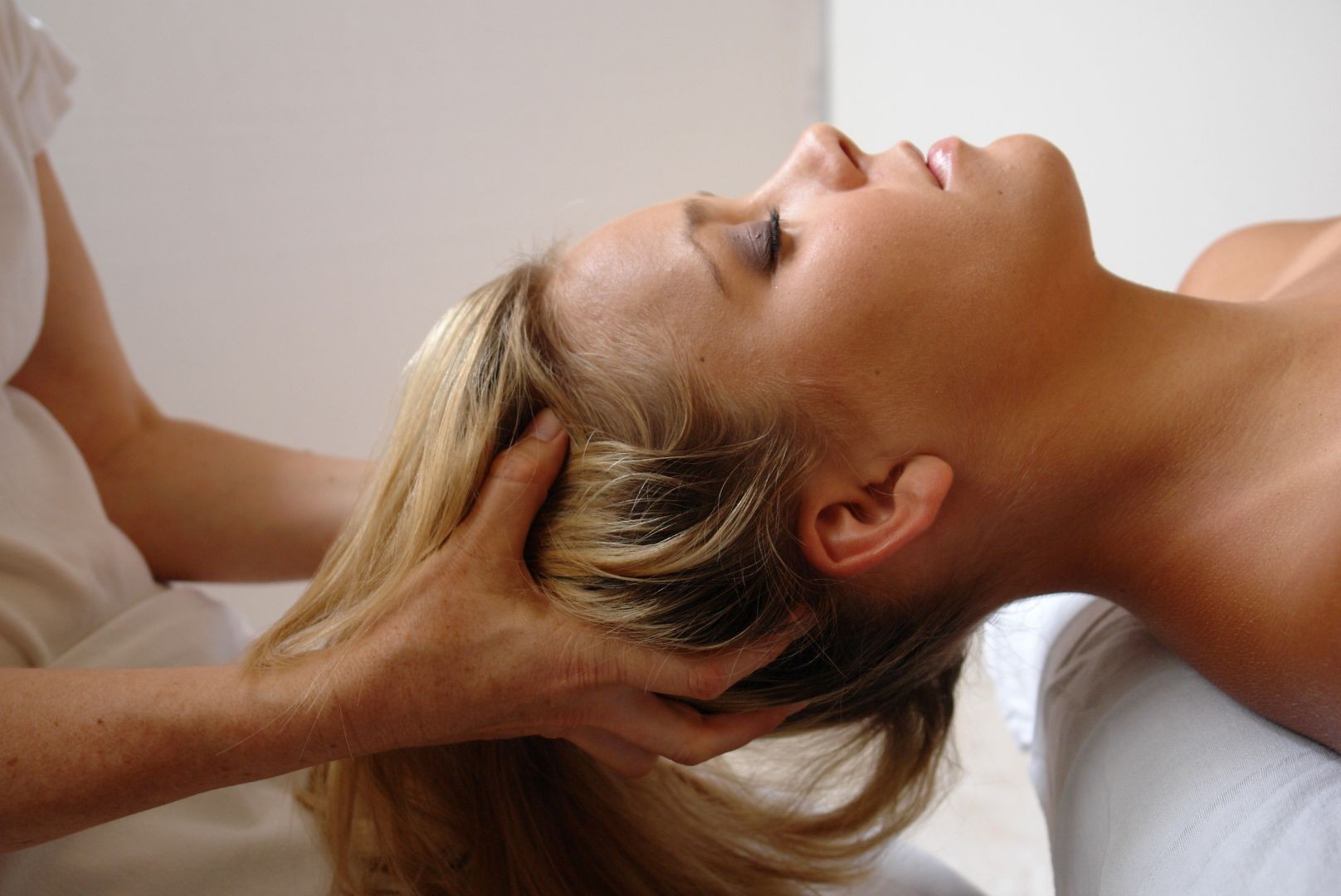 woman receiving scalp massage